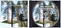 a cd with a picture of a tree and a cd with a picture of a tree